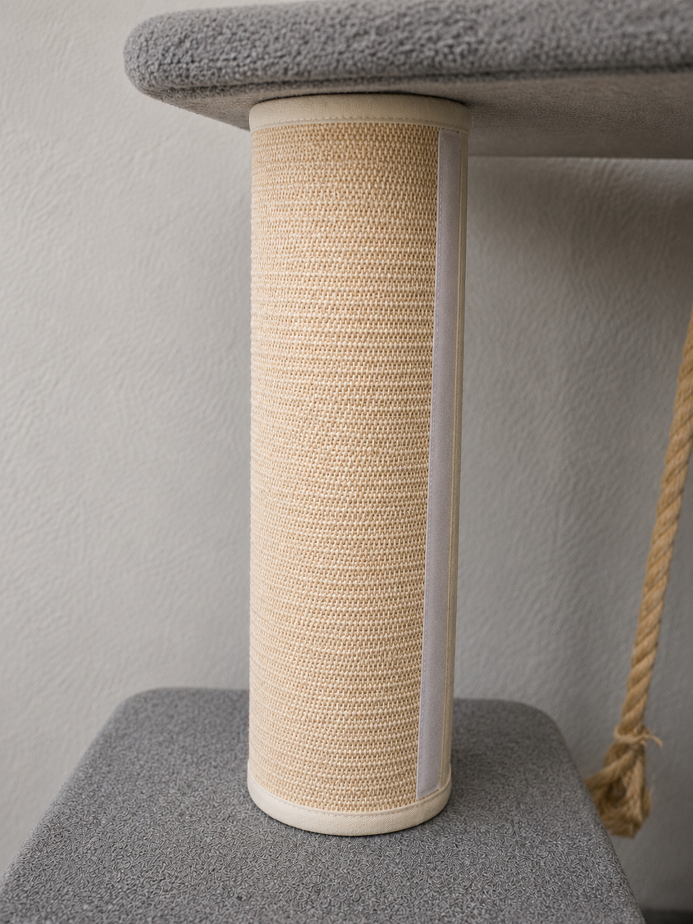 Removable scratching wrap being installed around a cat tree post